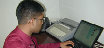 Mangement student working on a laptop
