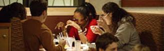 image of students gathered at restaurant